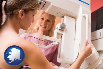 a nurse assisting a patient with a mammogram test - with Alaska icon